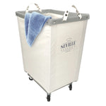 Corner Heavy-Duty Canvas Hamper w/Wheels, 24"W x 17.7"D, Natural White | Space-saving corner design holds 3 to 4 loads of laundry with a durable steel frame, smooth-rolling locking wheels