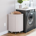 Corner Heavy-Duty Canvas Hamper w/Wheels, 24"W x 17.7"D, Natural White | Space-saving corner design holds 3 to 4 loads of laundry with a durable steel frame, smooth-rolling locking wheels
