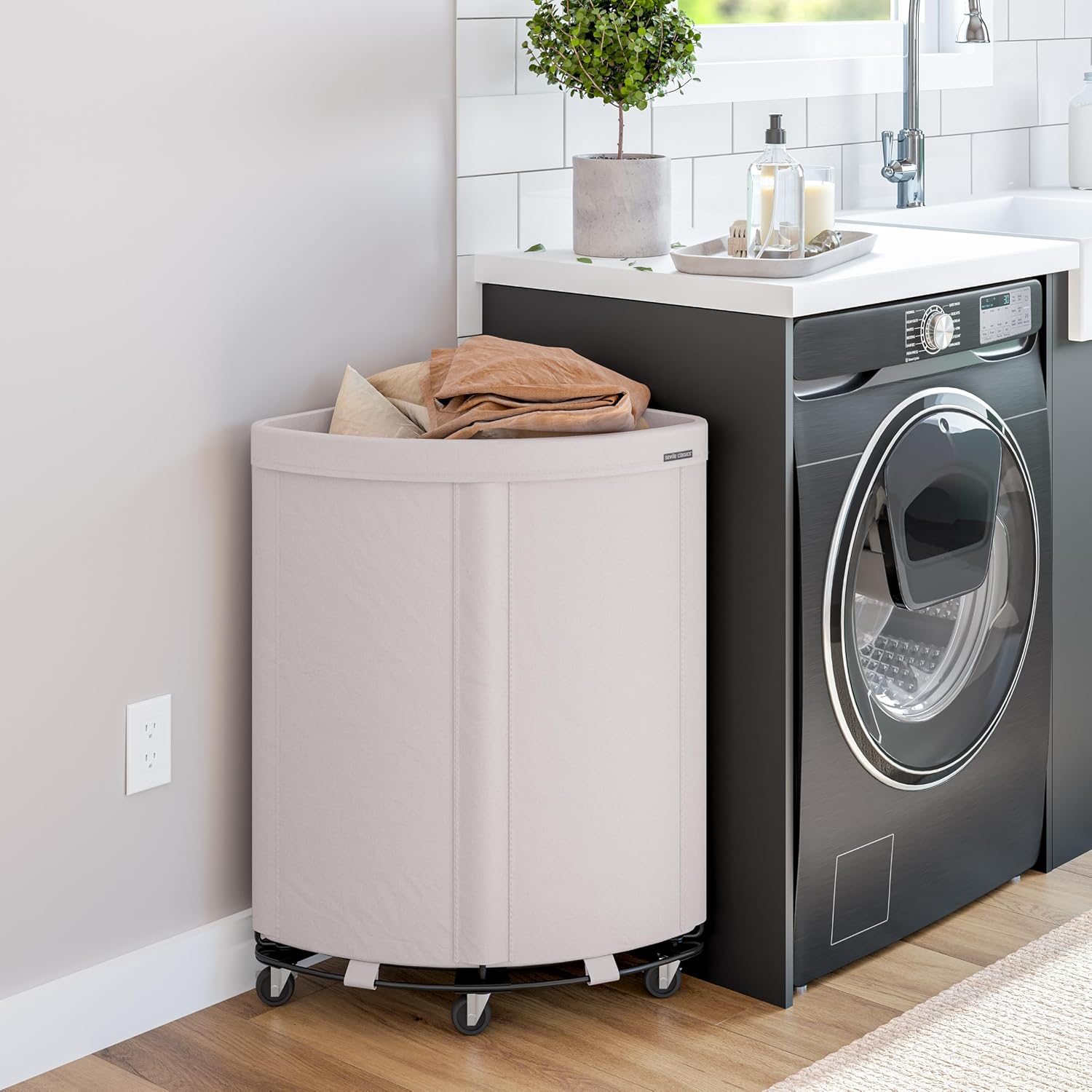 Corner Heavy-Duty Canvas Hamper w/Wheels, 24"W x 17.7"D, Natural White | Space-saving corner design holds 3 to 4 loads of laundry with a durable steel frame, smooth-rolling locking wheels