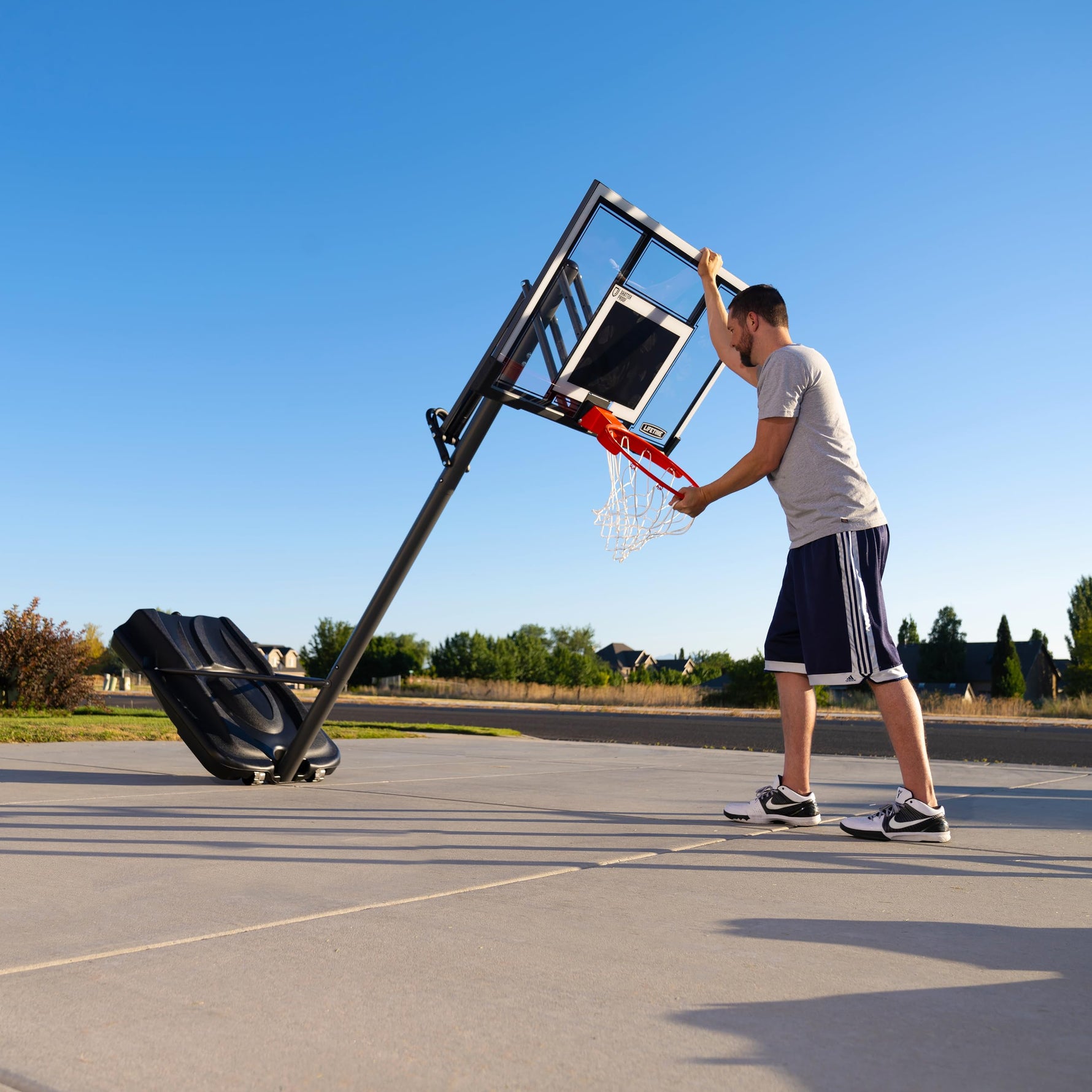 Lifetime Adjustable Portable Basketball Hoop, 54-Inch Shatterproof Polycarbonate Backboard, Slam-It Pro Rim, Adjustable Height 7.5-10 Ft, Portable Heavy-Duty Base with Wheels