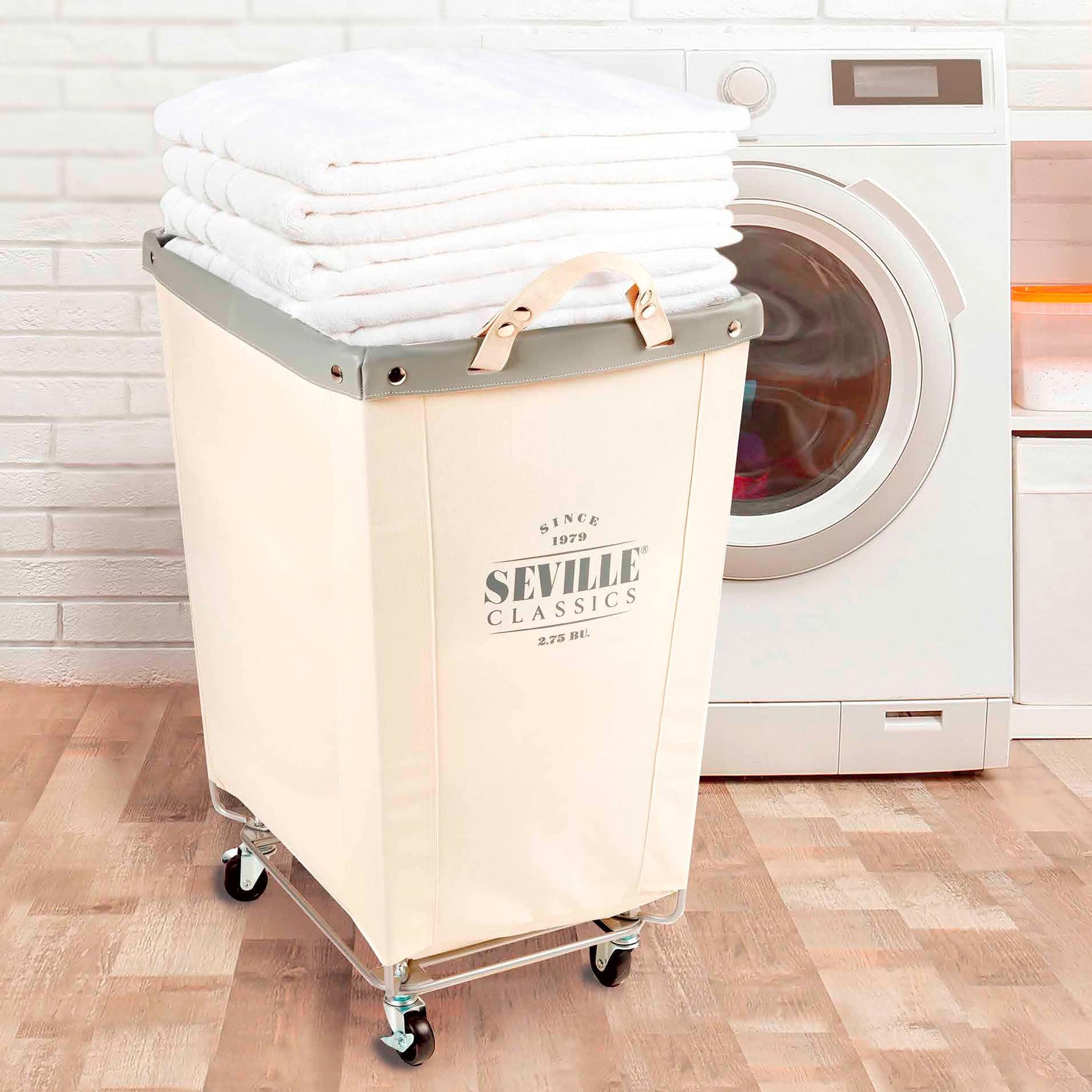 Corner Heavy-Duty Canvas Hamper w/Wheels, 24"W x 17.7"D, Natural White | Space-saving corner design holds 3 to 4 loads of laundry with a durable steel frame, smooth-rolling locking wheels